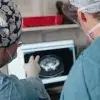 Two clinicians in front of a monitor