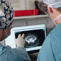 Two clinicians in front of a monitor